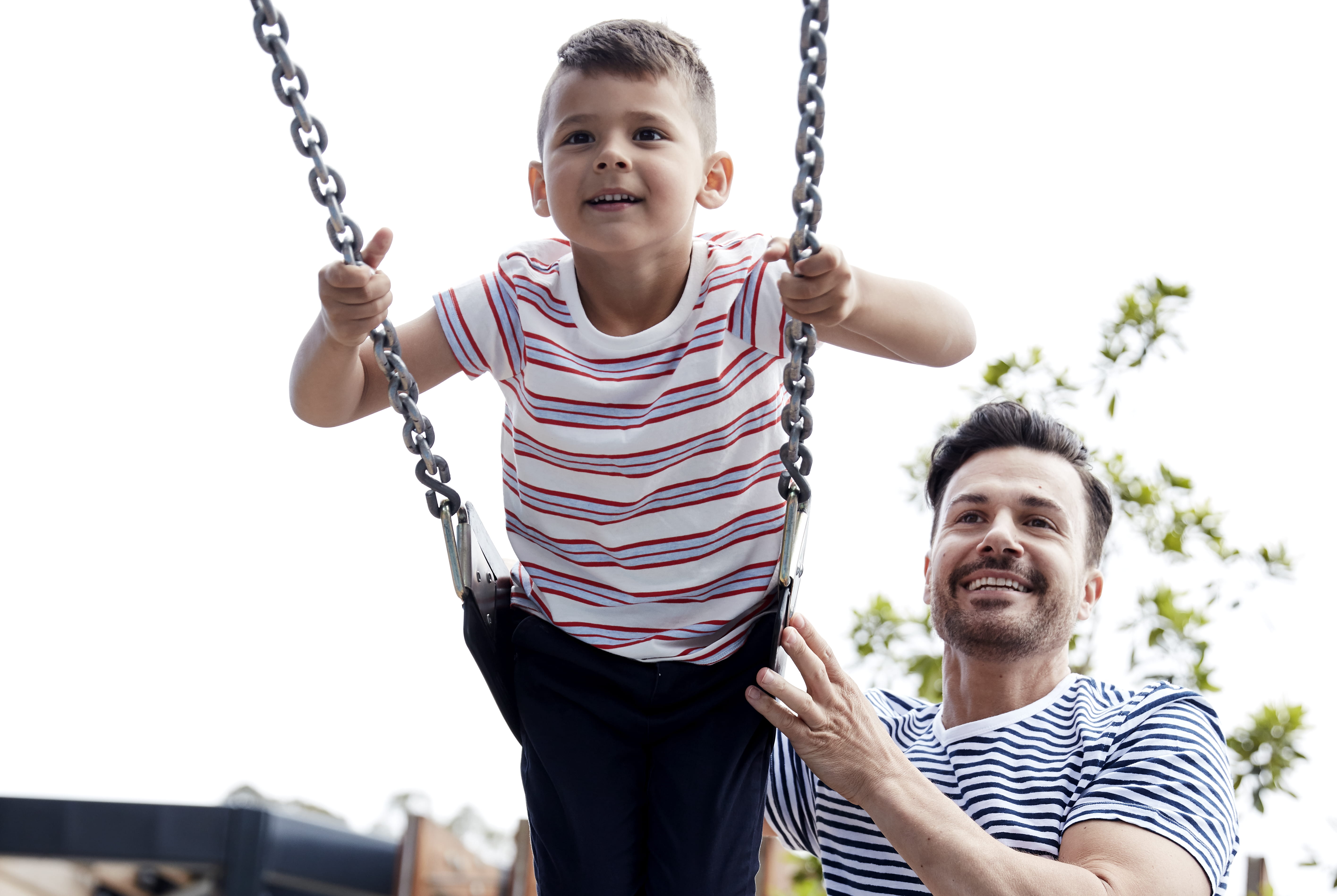 Father and child on swing